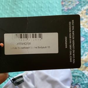 White pretty little things body suit